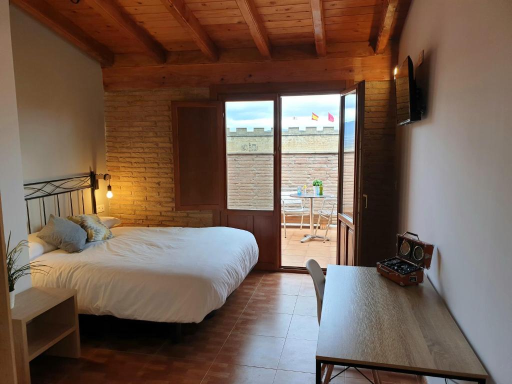 Postel nebo postele na pokoji v ubytování B&B La Atalaya