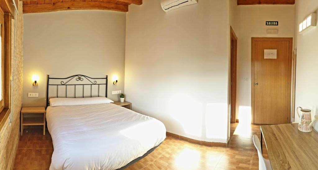 Postel nebo postele na pokoji v ubytování B&B La Atalaya