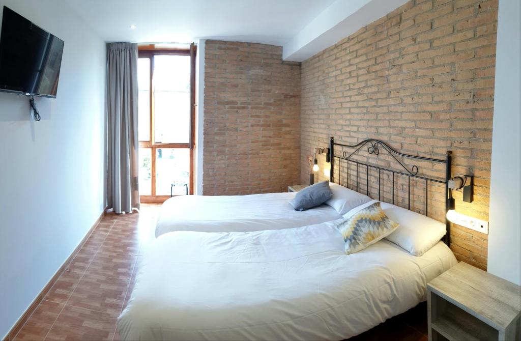 Postel nebo postele na pokoji v ubytování B&B La Atalaya