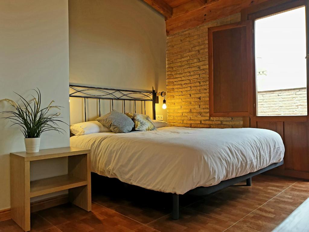 Postel nebo postele na pokoji v ubytování B&B La Atalaya