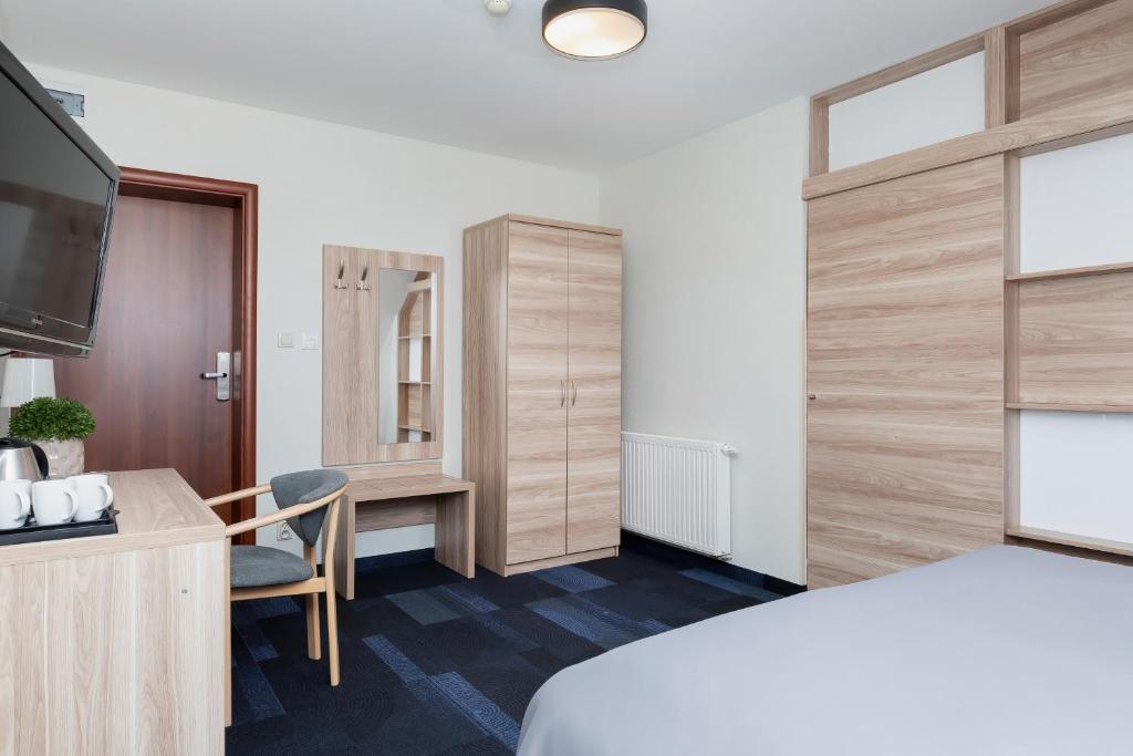 Postel nebo postele na pokoji v ubytování Nawigator SPA