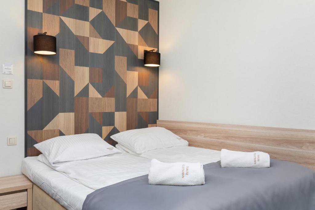 Postel nebo postele na pokoji v ubytování Nawigator SPA