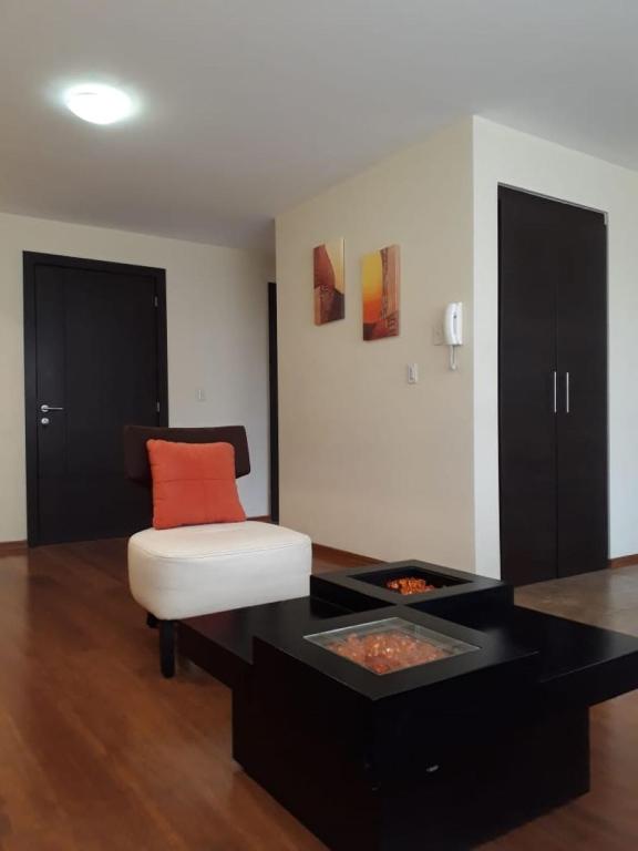 Postel nebo postele na pokoji v ubytování Misuitehotel La Carolina Quito