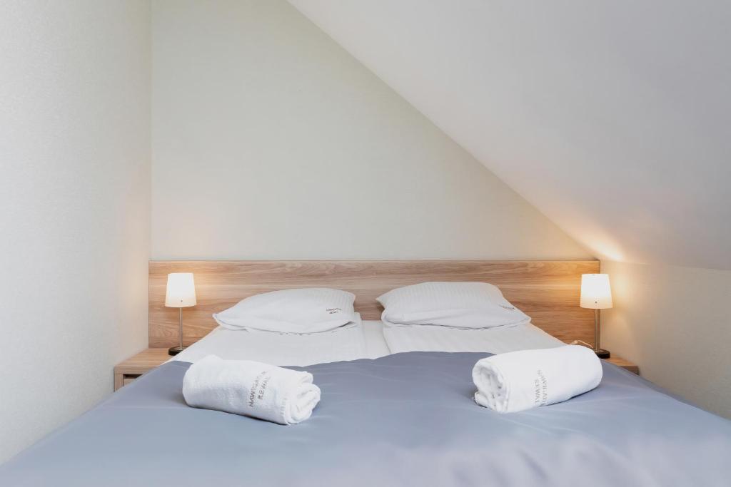 Postel nebo postele na pokoji v ubytování Nawigator SPA