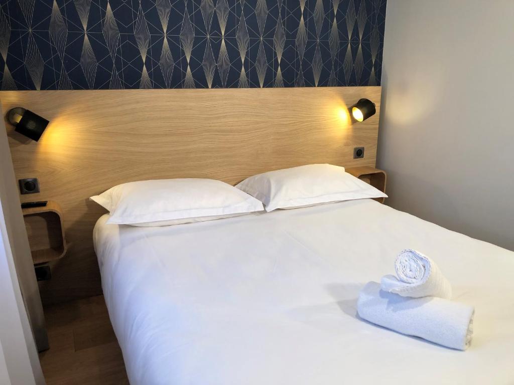 Postel nebo postele na pokoji v ubytování Oskar Hotel