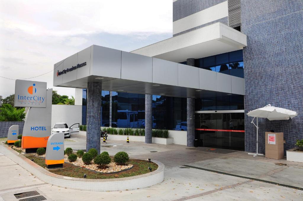 a large building with a sign in front of it at Intercity Manaus in Manaus