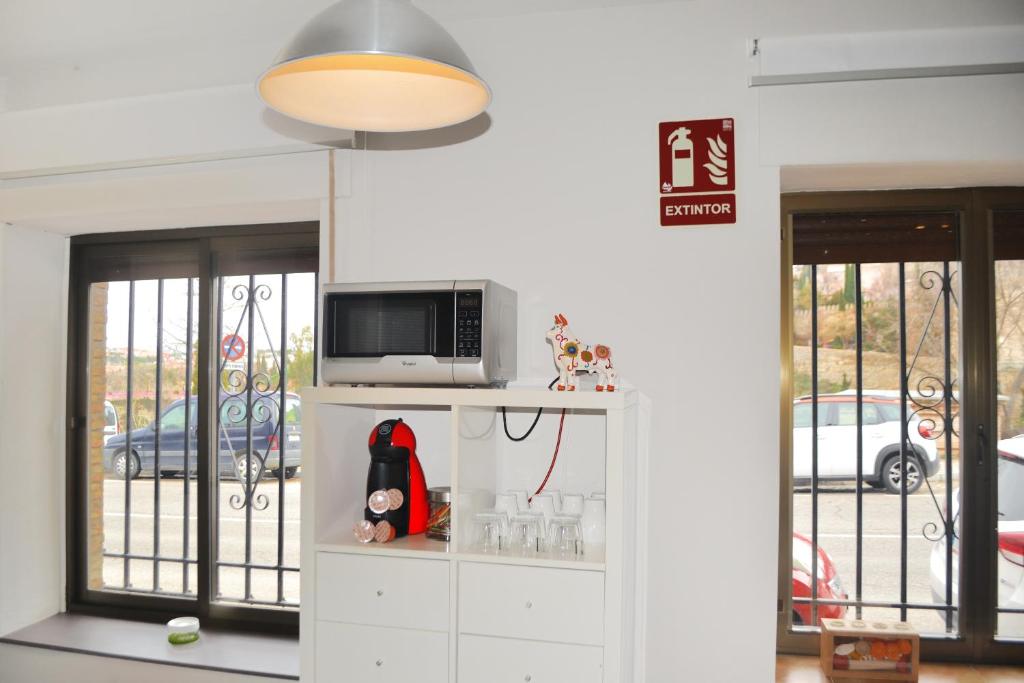 Televízia a/alebo spoločenská miestnosť v ubytovaní Apartamento El Monasterio