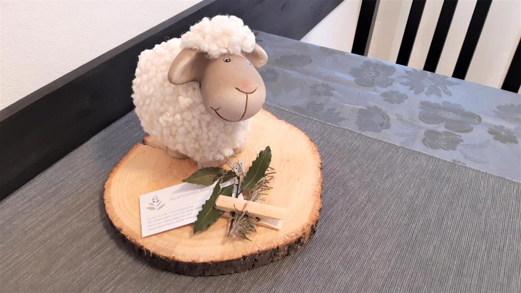 a cake of a sheep with a cross on a table at Apartments Nadia Sokolić in Nerezine