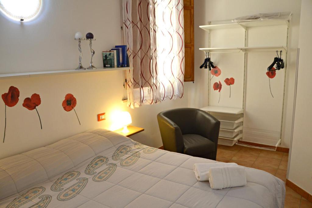 Łóżko lub łóżka w pokoju w obiekcie Casa Vacanze Cappuccini