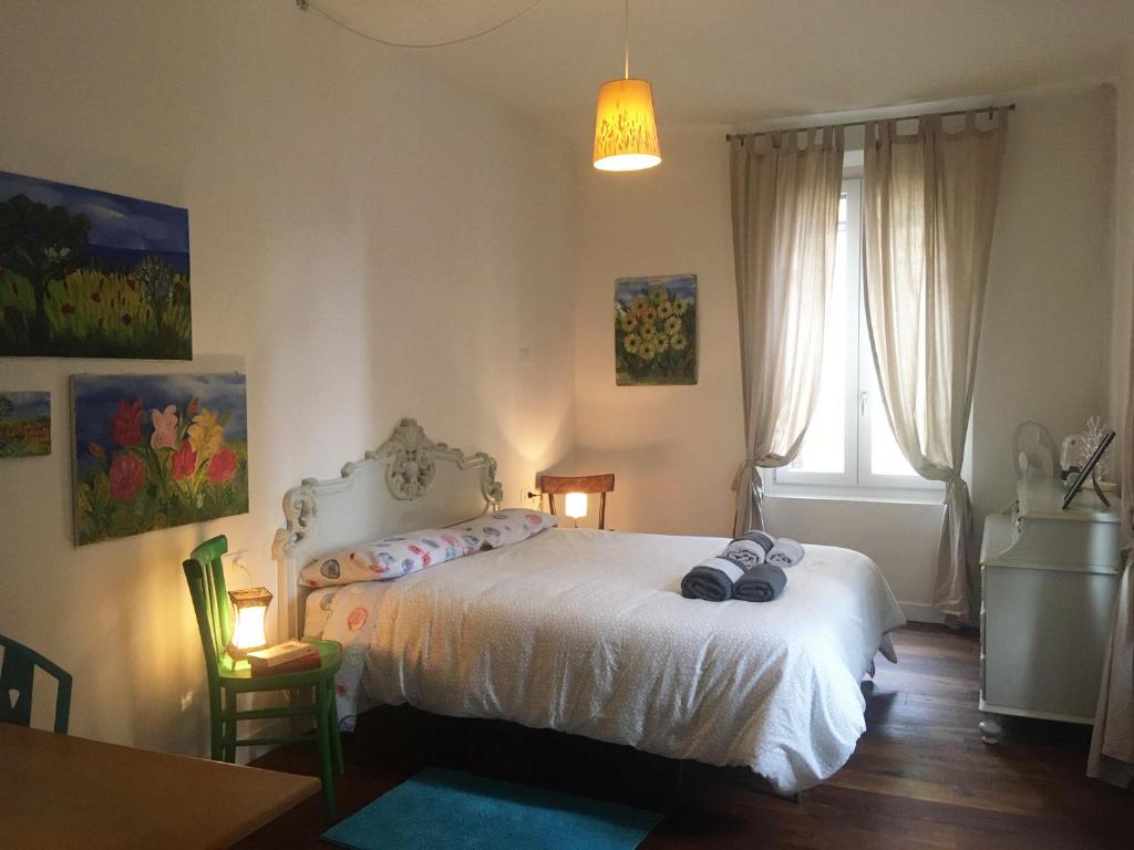 Łóżko lub łóżka w pokoju w obiekcie A casa di Nat