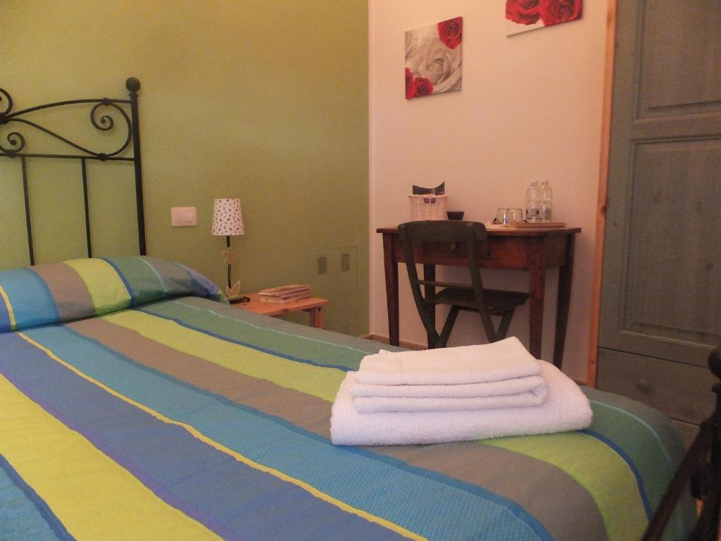 Postel nebo postele na pokoji v ubytování Cascina Antonini