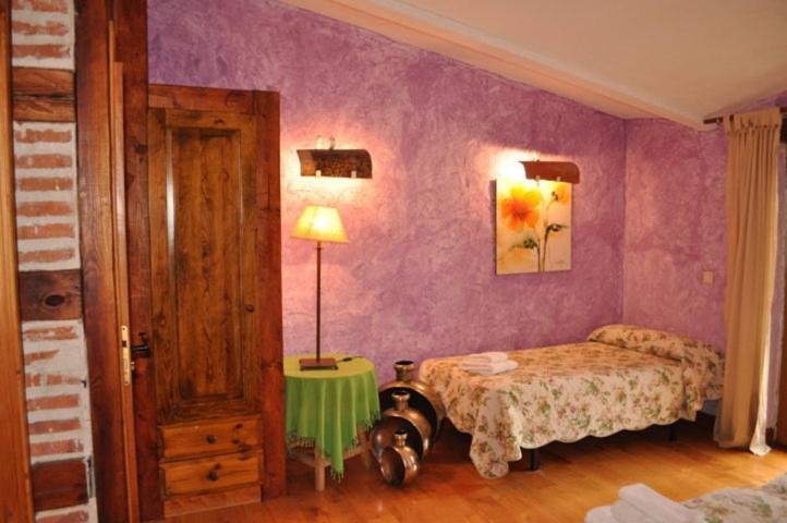 Postel nebo postele na pokoji v ubytování Hospedium Hacienda Las Cavas