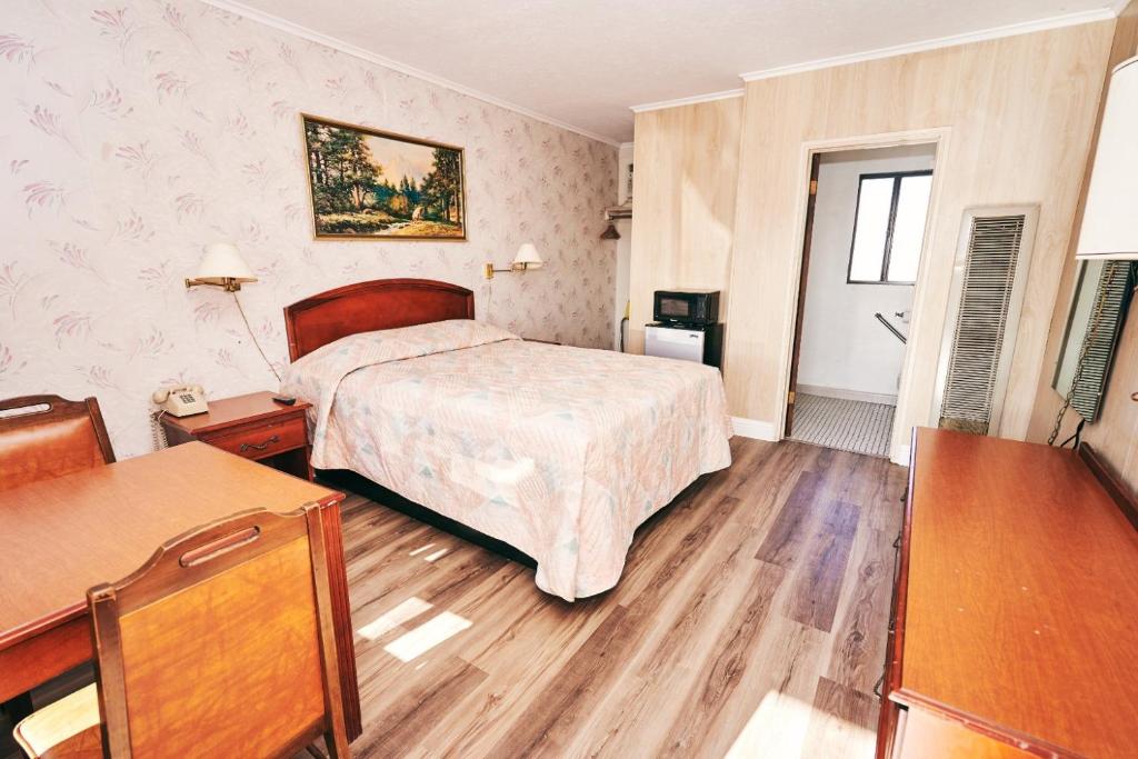 Postel nebo postele na pokoji v ubytování 7 Inn