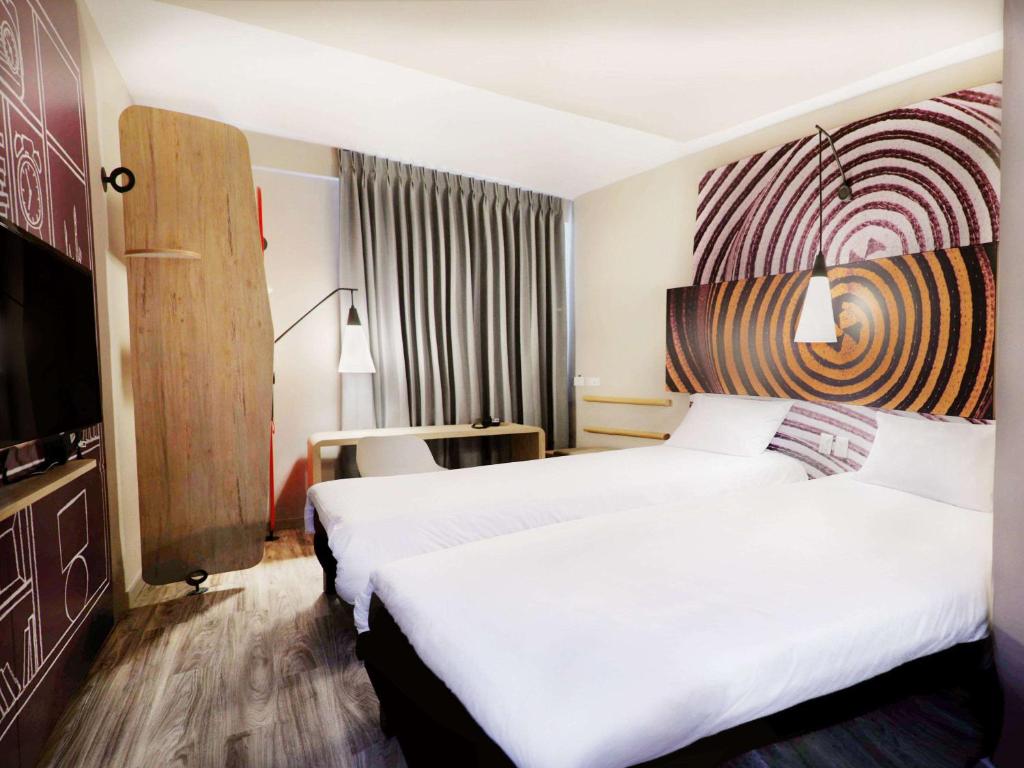 Postel nebo postele na pokoji v ubytování ibis Apartado