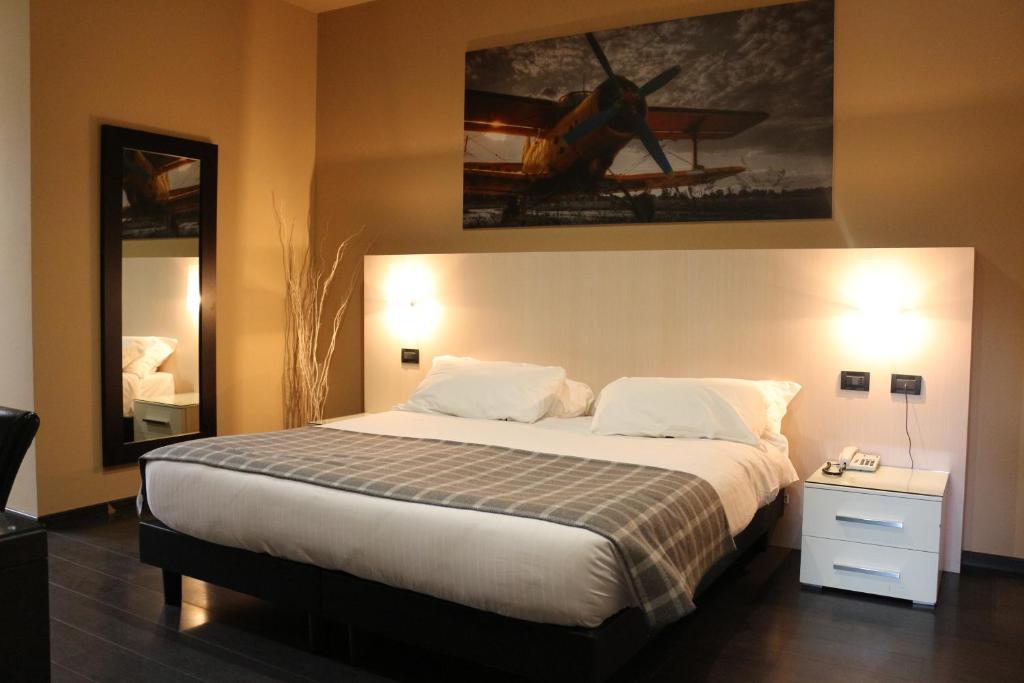 Postel nebo postele na pokoji v ubytování Hotel Garibaldi