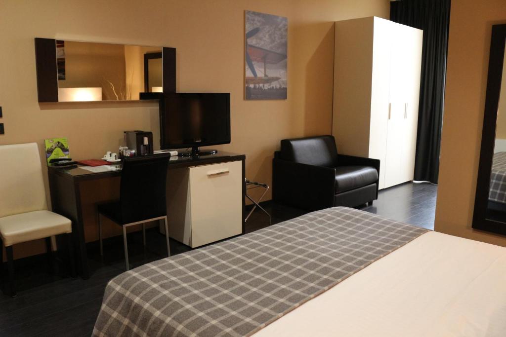 Kuchyň nebo kuchyňský kout v ubytování Hotel Garibaldi