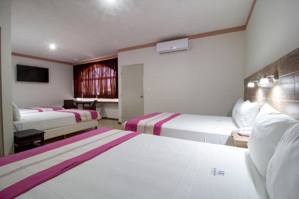Postel nebo postele na pokoji v ubytování Hotel El Español Centro Historico