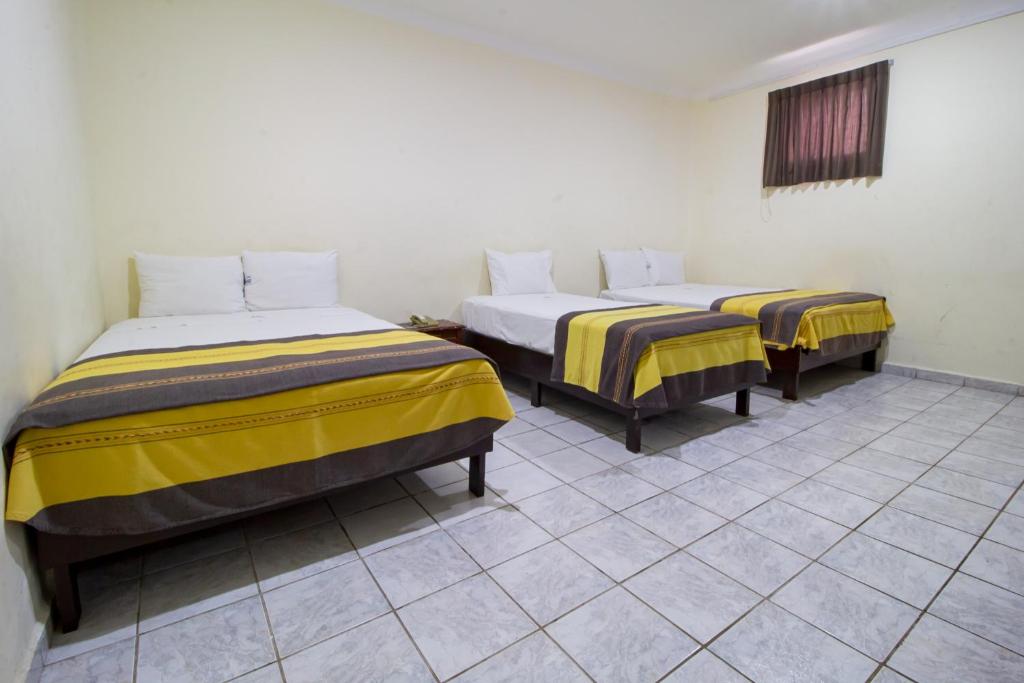 Postel nebo postele na pokoji v ubytování Hotel El Español Centro Historico