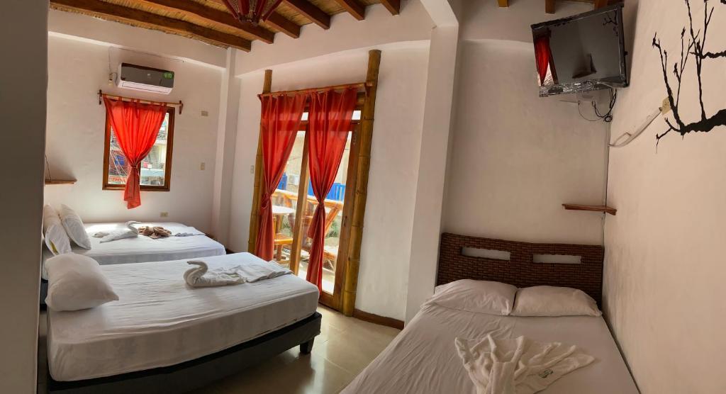 Postel nebo postele na pokoji v ubytování Hotel Karukera