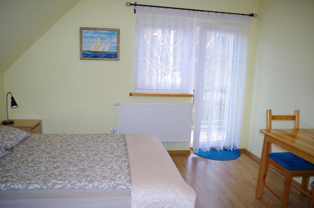 Posteľ alebo postele v izbe v ubytovaní U Iwony