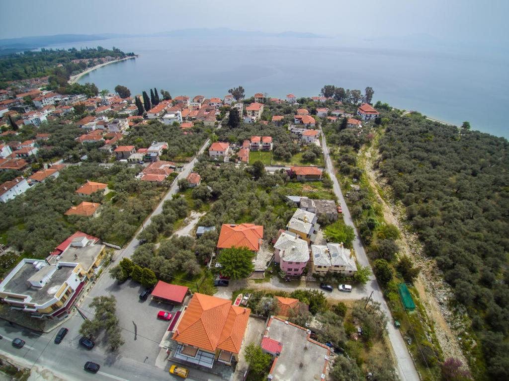an aerial view of a city with houses and the water at Alkifron Hotel in Kala Nera