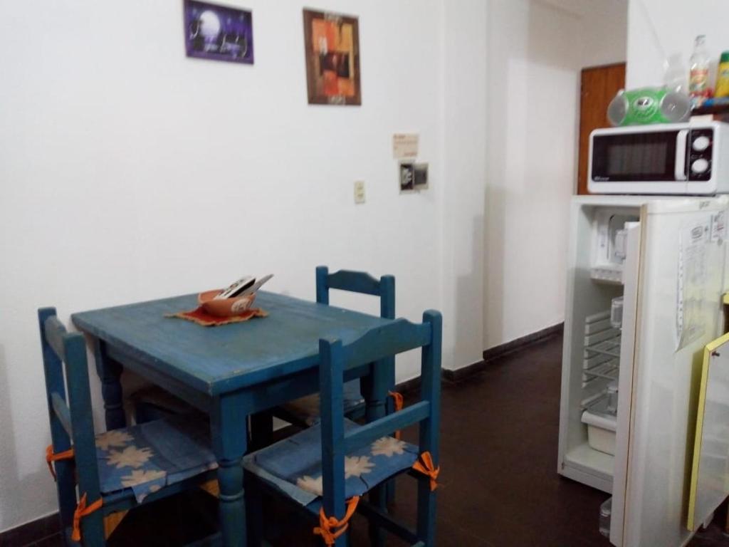 a blue table and chairs in a kitchen at Ayre del Tuyu in Mar del Tuyú