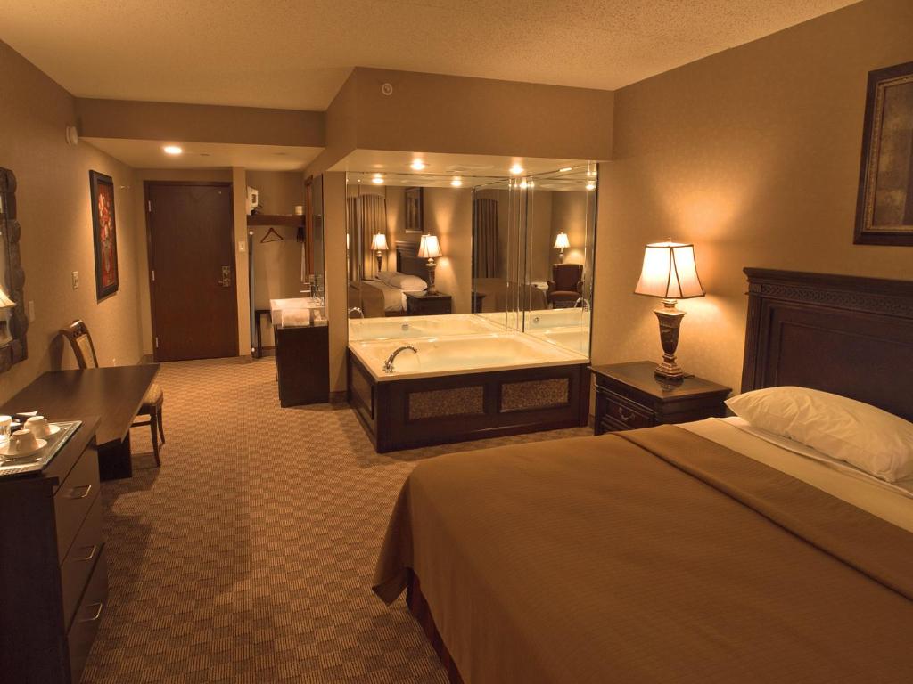 Postel nebo postele na pokoji v ubytování Salvatores Grand Hotel