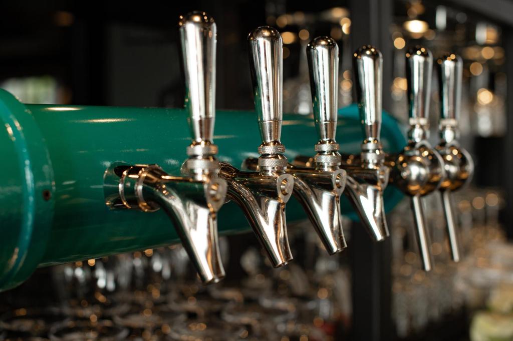 a row of wine glasses lined up on a machine at Hotel Indigo - Madison Downtown by IHG in Madison