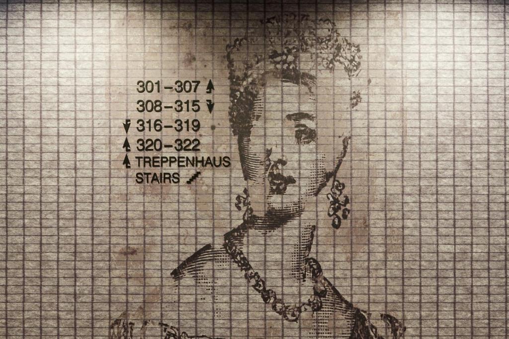a drawing of a woman with grapes on a grid at Hotel Indigo Dresden - Wettiner Platz by IHG in Dresden