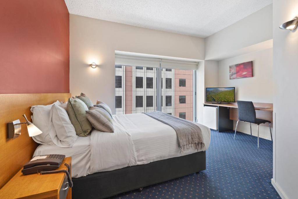 Postel nebo postele na pokoji v ubytování YEHS Hotel Melbourne CBD