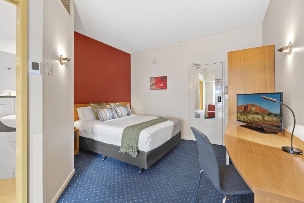Postel nebo postele na pokoji v ubytování YEHS Hotel Melbourne CBD