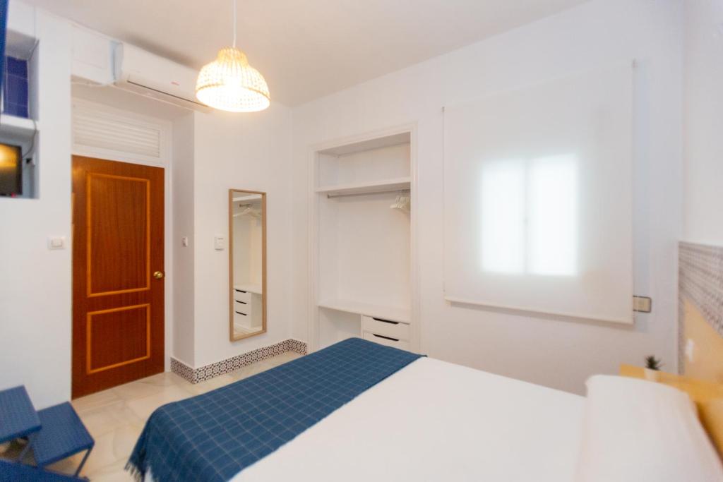 Postel nebo postele na pokoji v ubytování BOHEMIA SANLUCAR