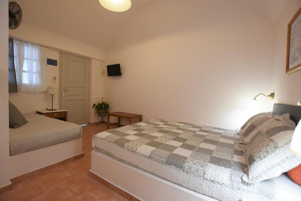 Postel nebo postele na pokoji v ubytování Rodakas Hotel