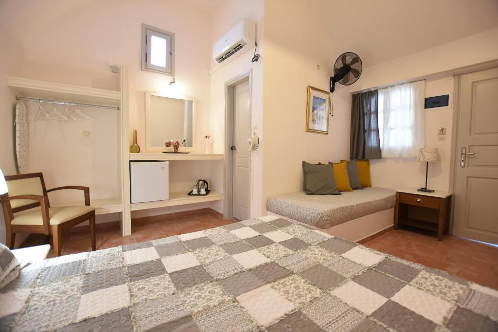 Postel nebo postele na pokoji v ubytování Rodakas Hotel