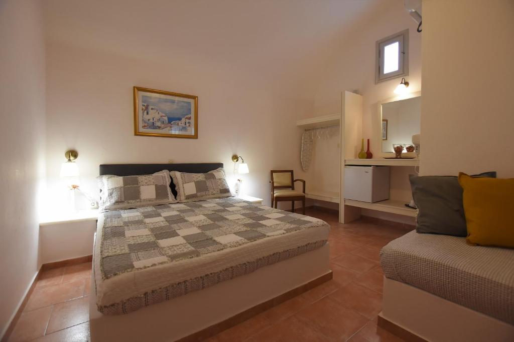Postel nebo postele na pokoji v ubytování Rodakas Hotel