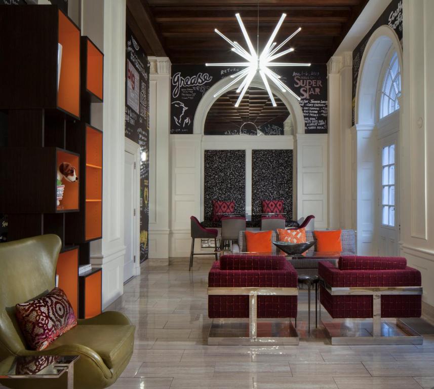 a living room filled with lots of furniture at Hotel Indigo Atlanta Midtown, an IHG Hotel in Atlanta