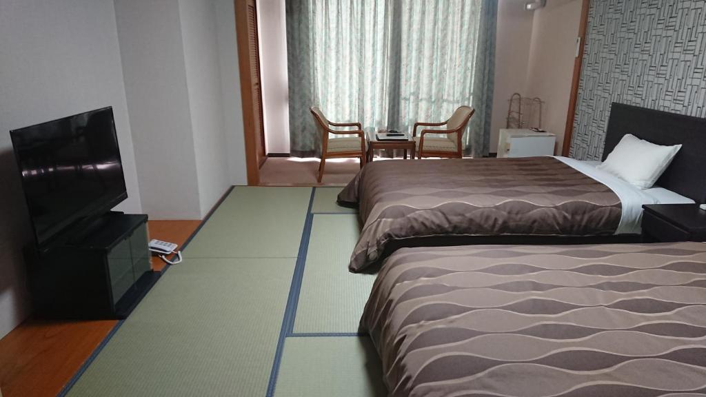 Postel nebo postele na pokoji v ubytování The Gran Resort Arima