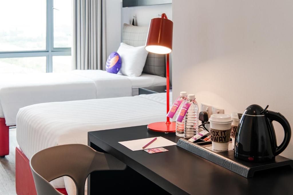 Postel nebo postele na pokoji v ubytování FOX Lite Hotel DPulze Cyberjaya