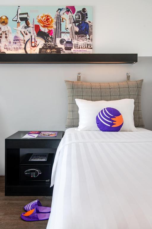 Postel nebo postele na pokoji v ubytování FOX Lite Hotel DPulze Cyberjaya