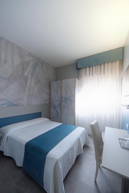 Postel nebo postele na pokoji v ubytování Hotel Master