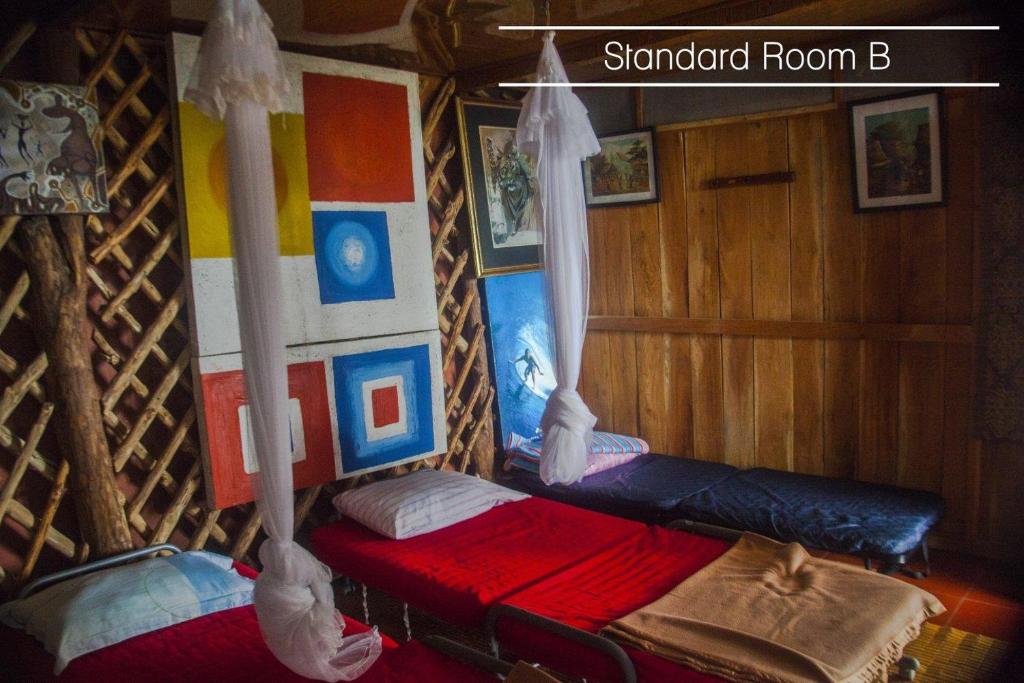 Postel nebo postele na pokoji v ubytování Karang Aji Beach Villa