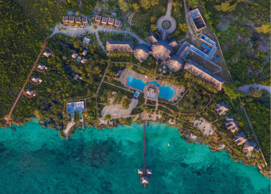 an aerial view of a resort in the water at Fruit & Spice Wellness Resort Zanzibar in Kizimkazi
