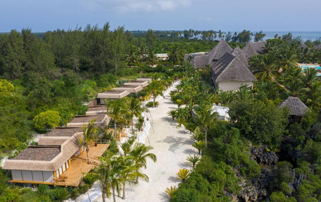 an aerial view of a resort with a beach at Fruit & Spice Wellness Resort Zanzibar in Kizimkazi