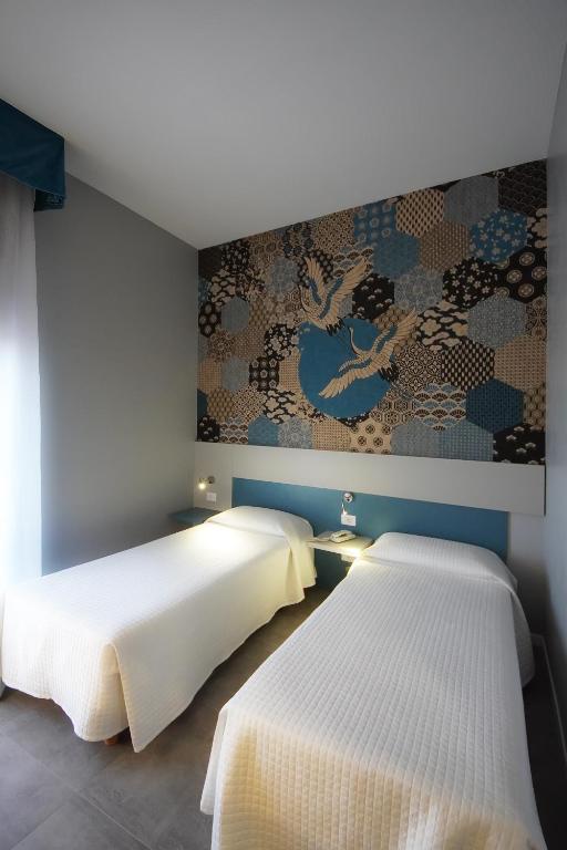 Postel nebo postele na pokoji v ubytování Hotel Master