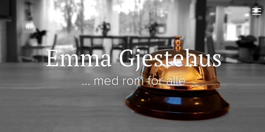 a gold bell sitting on top of a floor at Emma Gjestehus in Sandvika