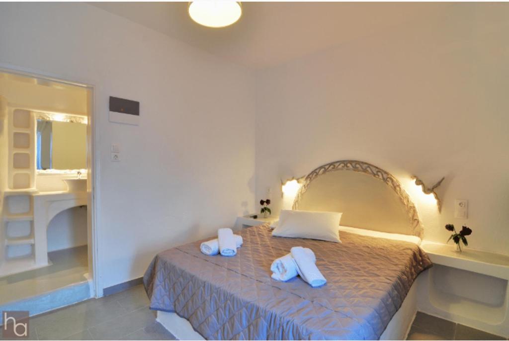 Postel nebo postele na pokoji v ubytování Adamas Hotel