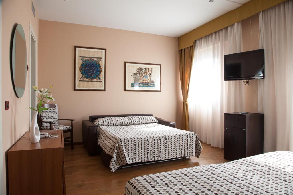 Postel nebo postele na pokoji v ubytování Hotel Master