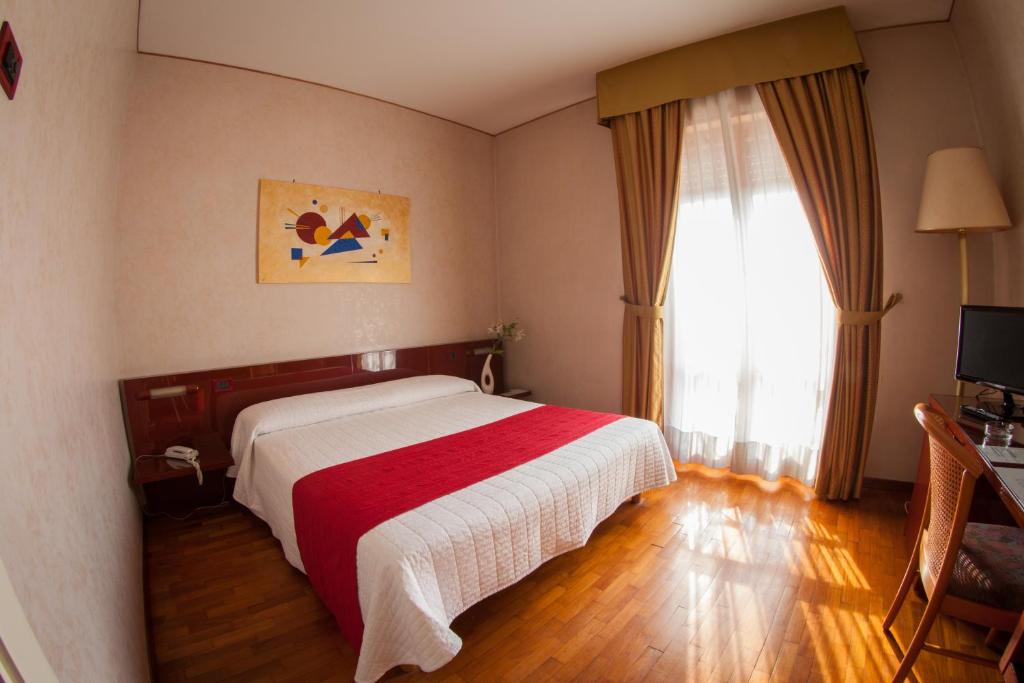 Postel nebo postele na pokoji v ubytování Hotel Master