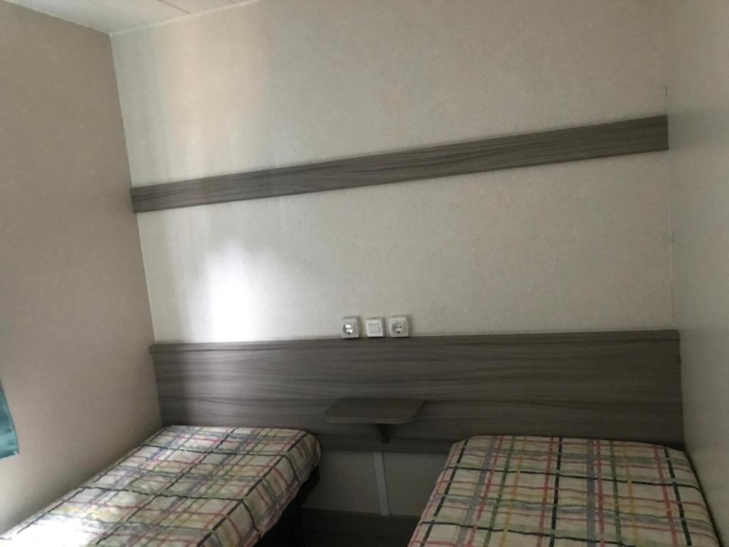 Postel nebo postele na pokoji v ubytování Camping Castell D'aro