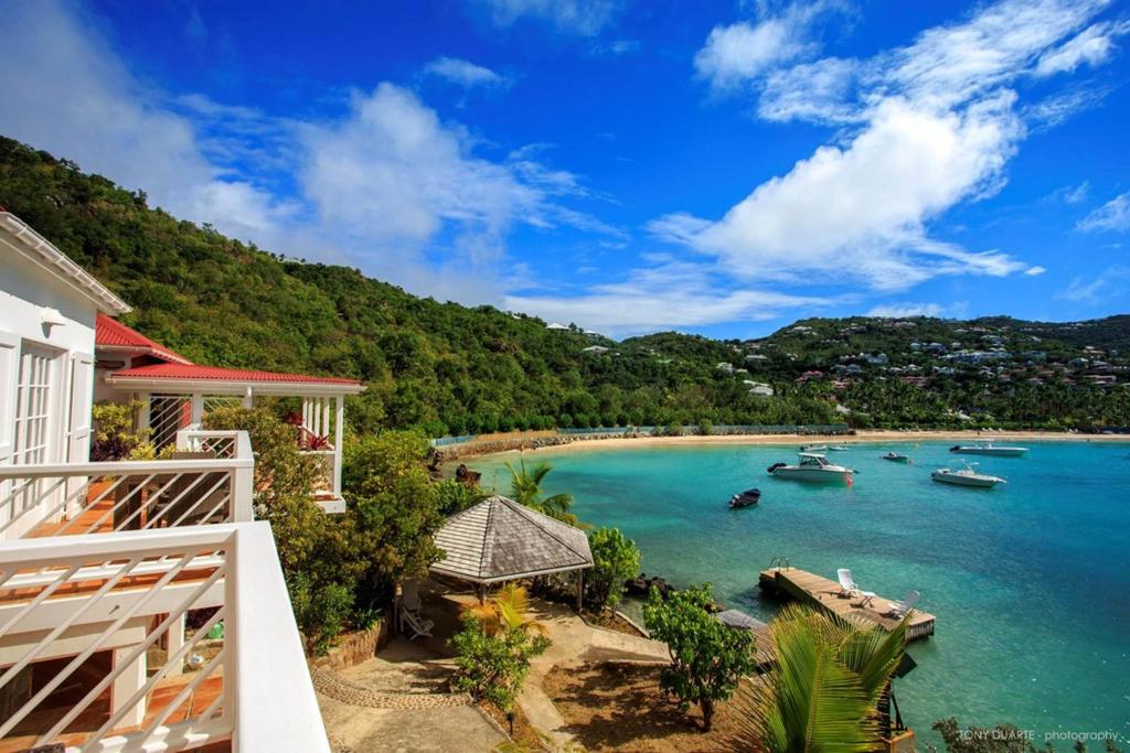 a view of a beach with boats in the water at Dream Villa St-Jean 597 in Saint Barthelemy